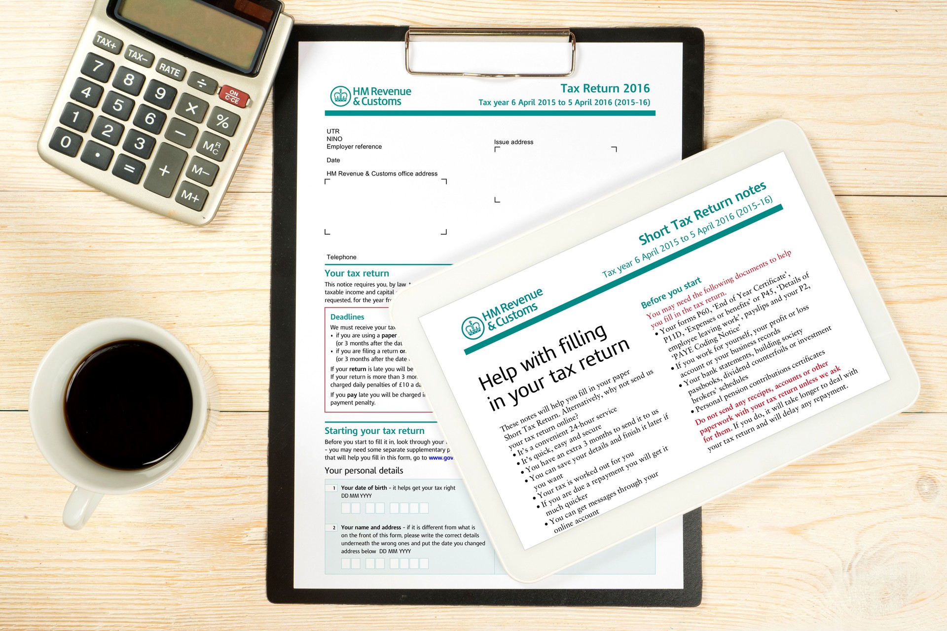 uk tax form sa100 with filling notes over office table